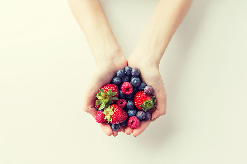 healthy fruit diet being held in a hand